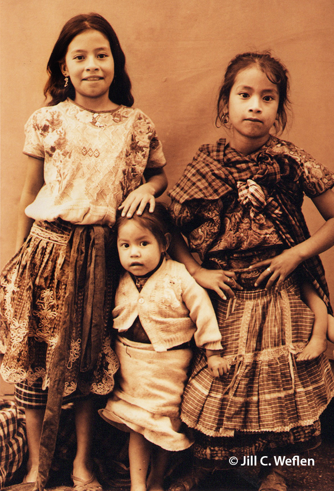 Three young girls in sepia tone