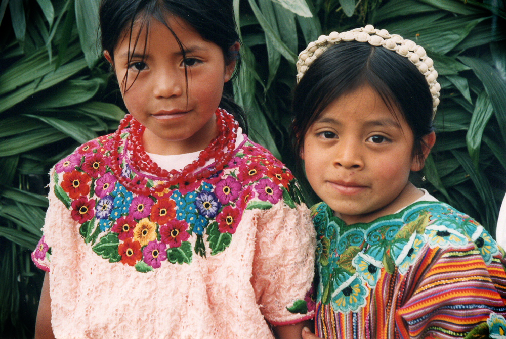 Two young girls in colorful traditional clothing