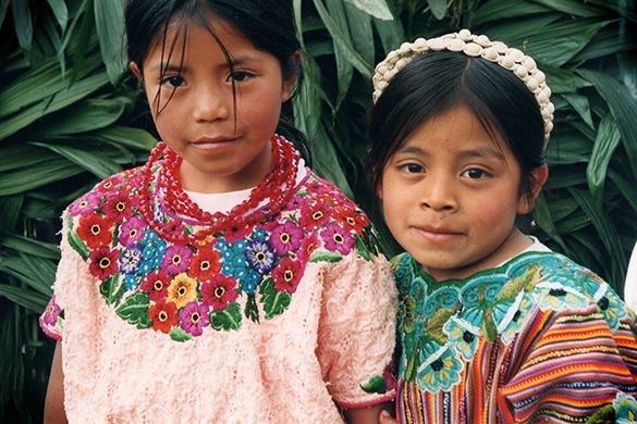 Two young girls in colorful clothing